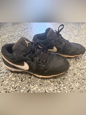 Nike Kids Jordan 1 Black and White Low-Top Cleats.